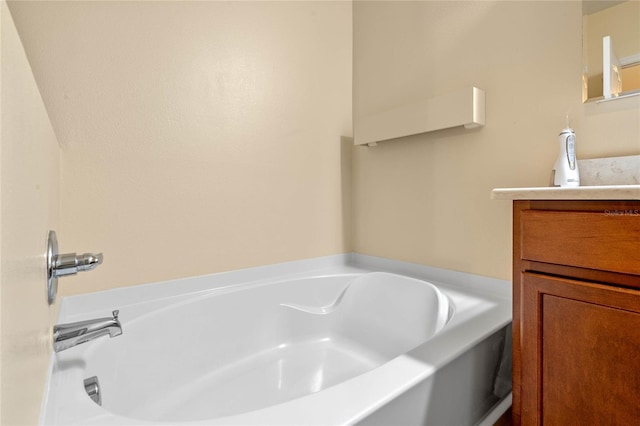 bathroom with vanity and a bathtub