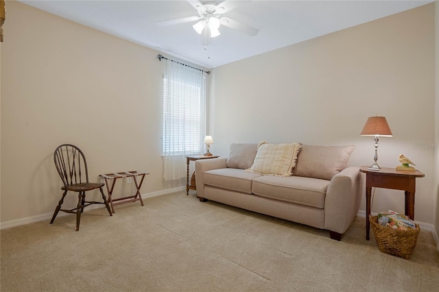 carpeted living room featuring ceiling fan