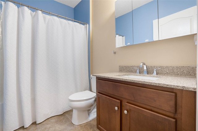 bathroom featuring vanity, toilet, and tile patterned floors