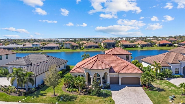 birds eye view of property with a water view