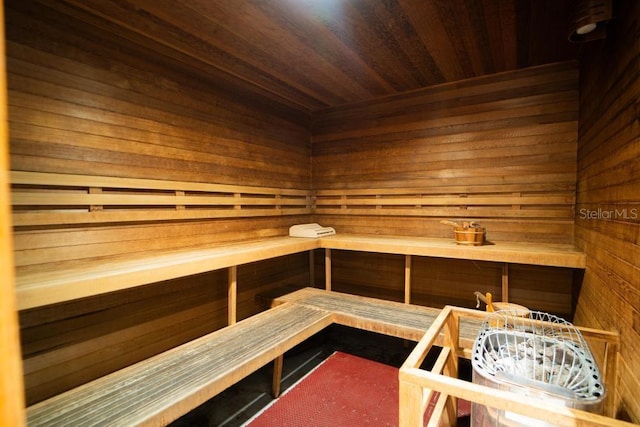 view of sauna / steam room with wood ceiling and wood walls