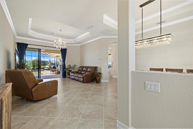 interior space with crown molding and a tray ceiling