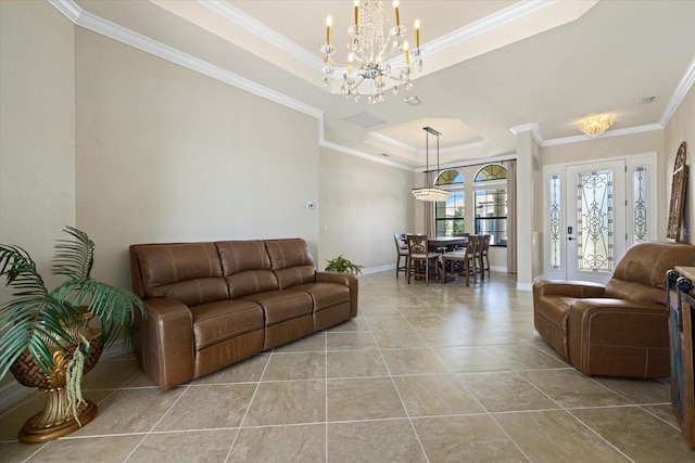 living room with a notable chandelier, ornamental molding, light tile patterned flooring, and a raised ceiling