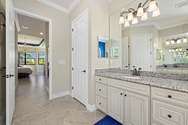 bathroom with vanity, crown molding, an inviting chandelier, and tile patterned flooring