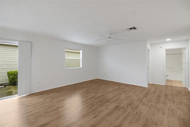 unfurnished room featuring ceiling fan and light hardwood / wood-style flooring