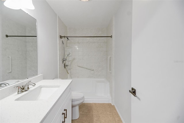 bathroom featuring toilet, vanity, and tile patterned flooring