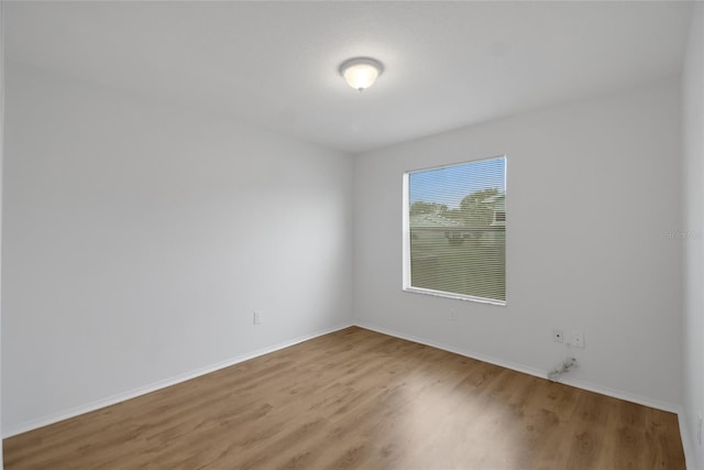 empty room with hardwood / wood-style floors