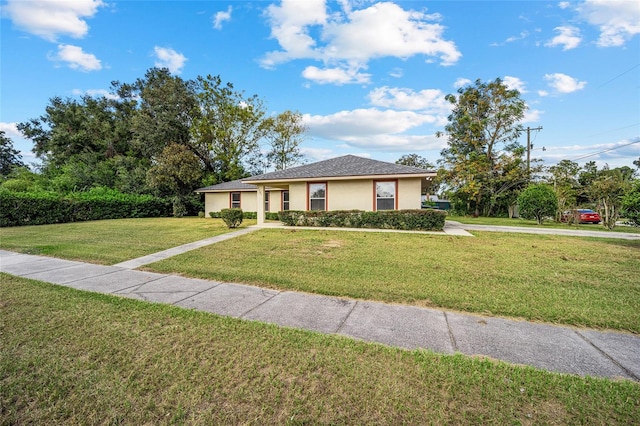 single story home with a front lawn