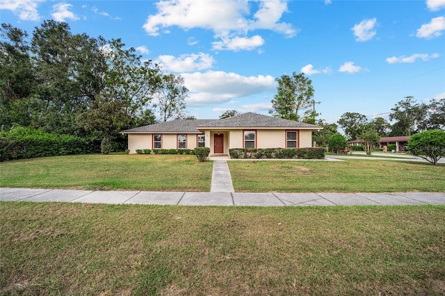 single story home with a front yard