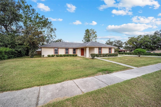 ranch-style home with a front yard