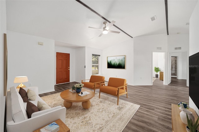 living room featuring ceiling fan, high vaulted ceiling, and dark hardwood / wood-style flooring