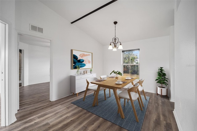 dining room featuring an inviting chandelier, lofted ceiling, and dark hardwood / wood-style flooring