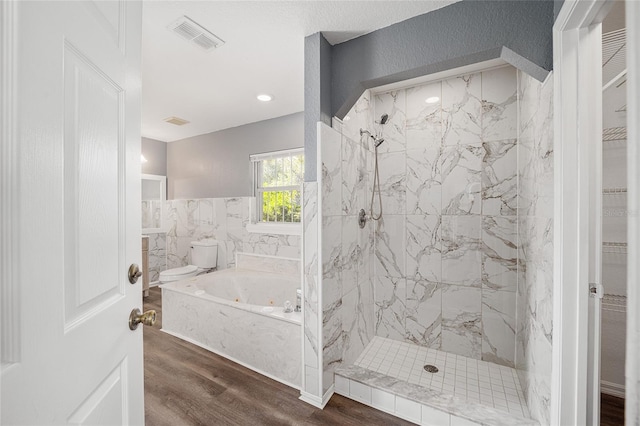 bathroom featuring shower with separate bathtub and hardwood / wood-style floors