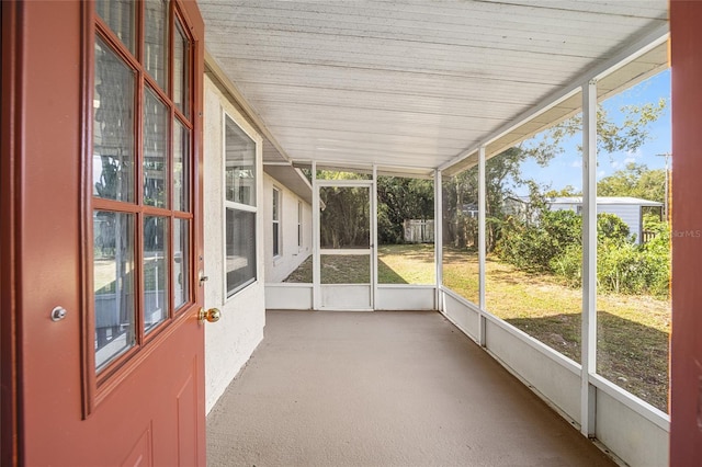 unfurnished sunroom featuring plenty of natural light