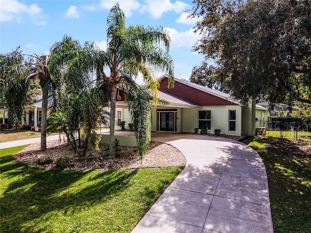 ranch-style house featuring a front yard