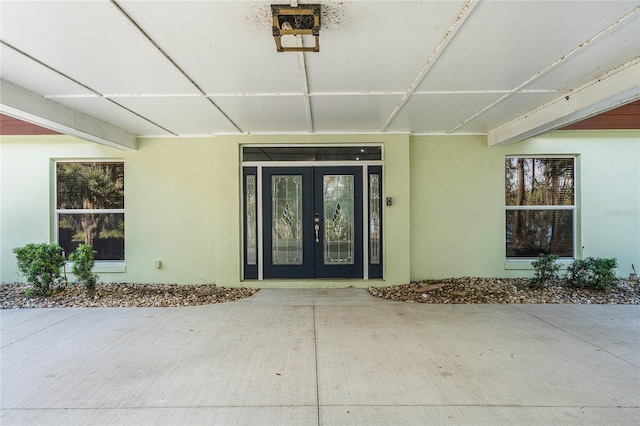 property entrance featuring french doors