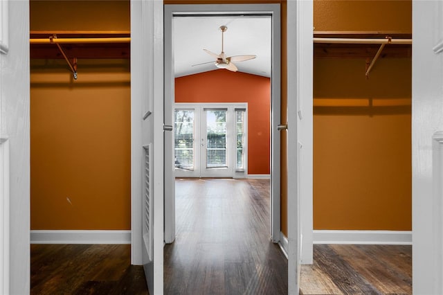 interior space featuring wood-type flooring, vaulted ceiling, and french doors