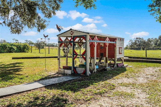 view of play area with a yard and a rural view