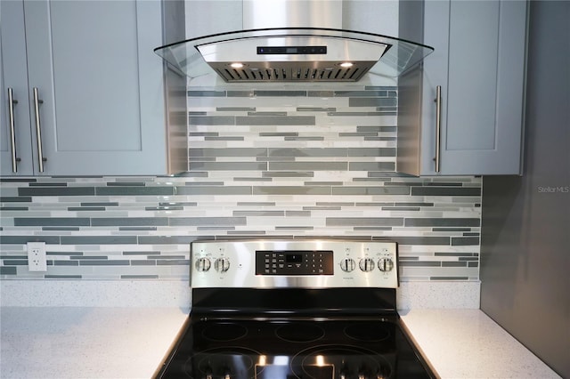 kitchen with electric stove, ventilation hood, and backsplash