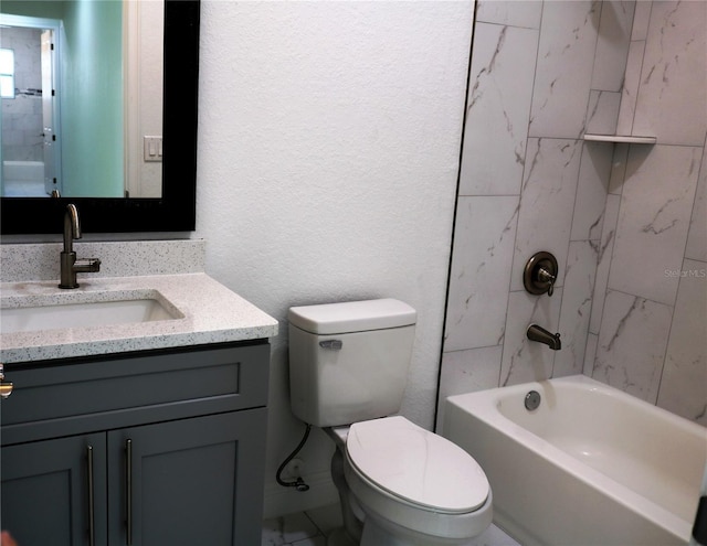 full bathroom featuring vanity, toilet, and tiled shower / bath