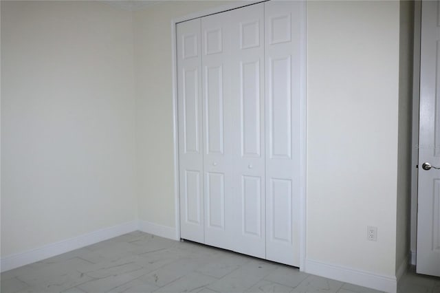 unfurnished bedroom with a closet