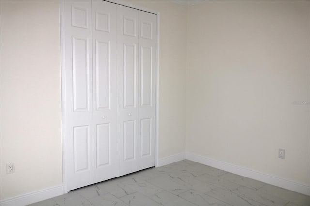 unfurnished bedroom featuring a closet