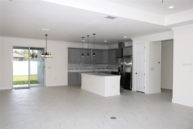 kitchen featuring gray cabinetry, visible vents, refrigerator with ice dispenser, marble finish floor, and backsplash