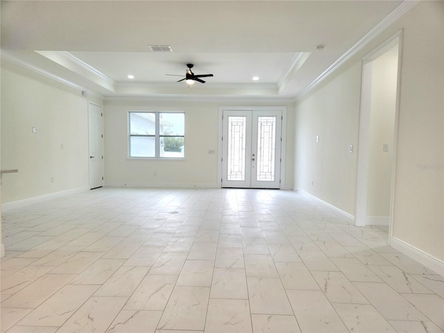 empty room featuring marble finish floor, french doors, a raised ceiling, and visible vents