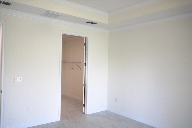 unfurnished bedroom featuring marble finish floor, ornamental molding, visible vents, and baseboards