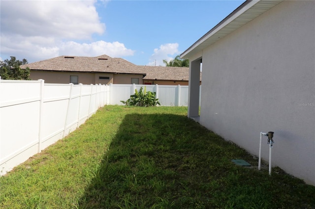 view of yard with a fenced backyard