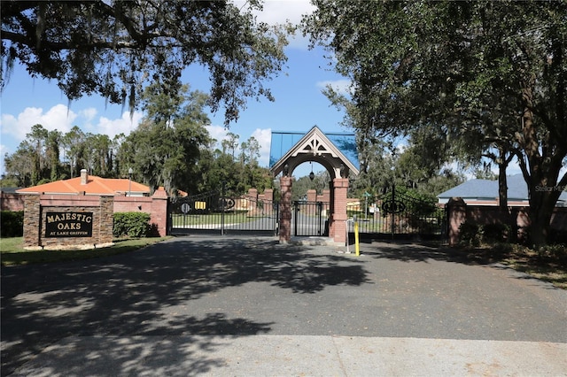 view of road featuring a gated entry and a gate