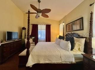 bedroom featuring ceiling fan and lofted ceiling