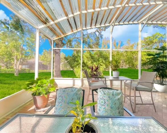 119 Crescent Moon Dr, Groveland, FL 34736 - sunroom / solarium featuring outdoor dining space
