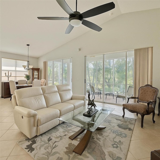 119 Crescent Moon Dr, Groveland, FL 34736 - living area featuring light tile patterned floors, plenty of natural light, ceiling fan, and high vaulted ceiling