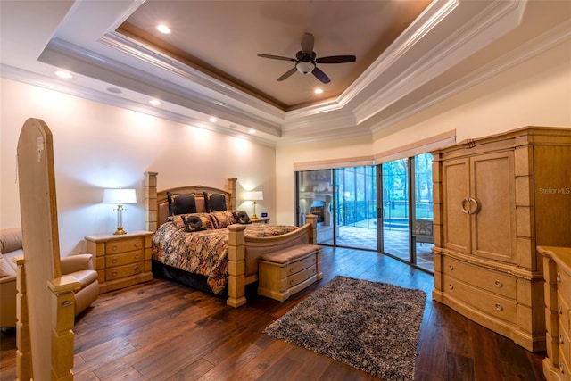 bedroom with access to outside, crown molding, ceiling fan, a tray ceiling, and dark hardwood / wood-style flooring