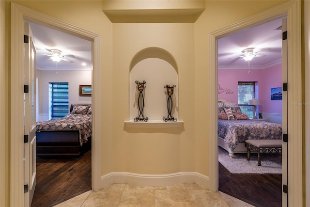 hall featuring hardwood / wood-style floors and crown molding