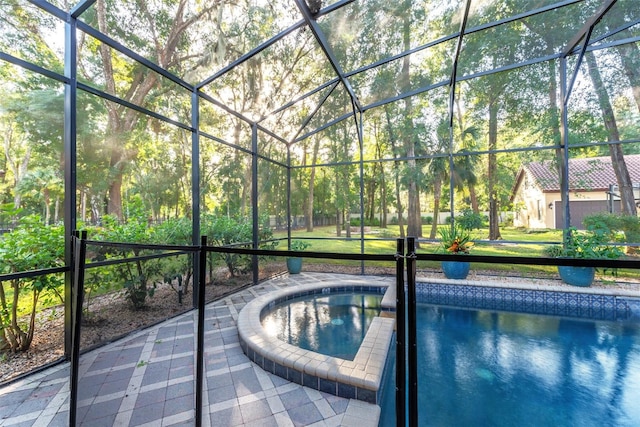 view of pool with an in ground hot tub and glass enclosure