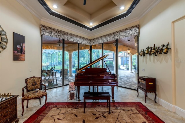 miscellaneous room with a tray ceiling, crown molding, and tile patterned flooring