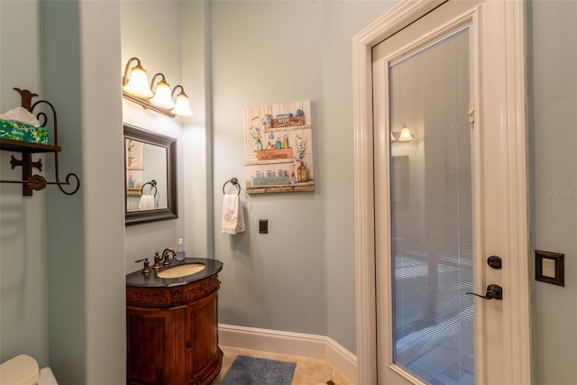 bathroom featuring tile patterned floors and vanity