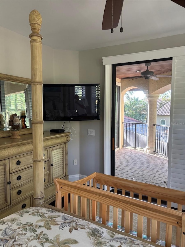 bedroom with access to outside and multiple windows