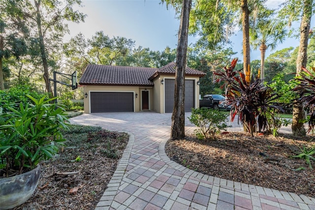 mediterranean / spanish-style home featuring a garage