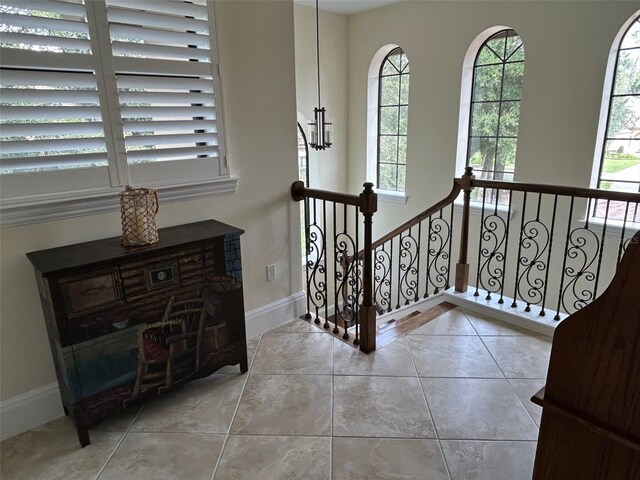 staircase with tile patterned floors