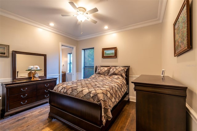 bedroom with ornamental molding, ceiling fan, and dark wood-type flooring