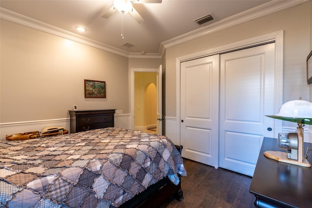 bedroom featuring crown molding, a closet, ceiling fan, and dark hardwood / wood-style floors