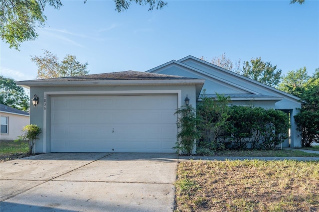 single story home with a garage