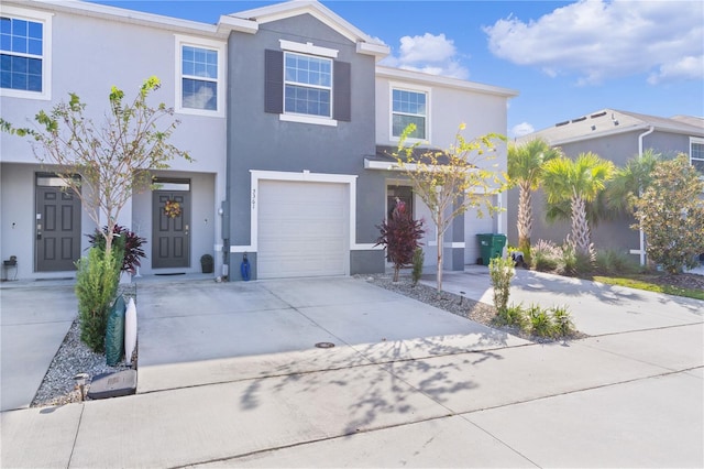 townhome / multi-family property featuring a garage