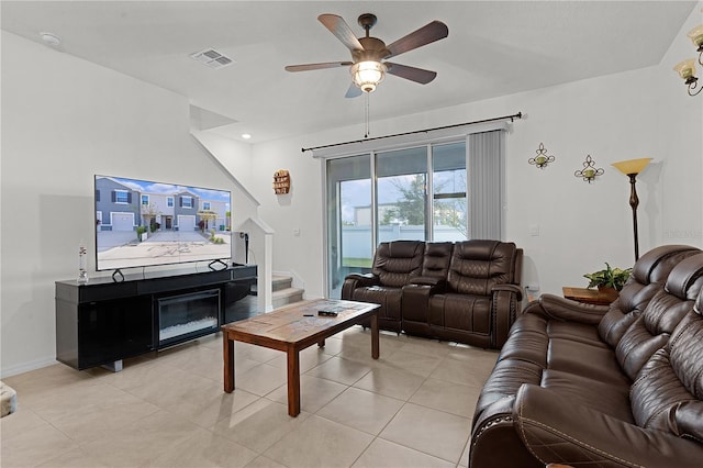 living room featuring ceiling fan and light tile patterned floors