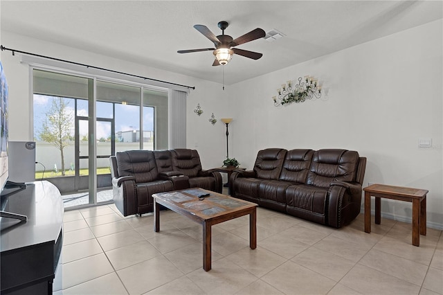 tiled living room with ceiling fan