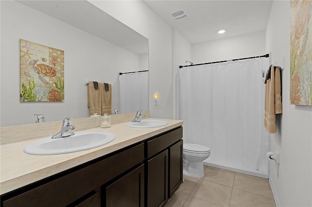 bathroom with vanity, toilet, a shower with curtain, and tile patterned flooring