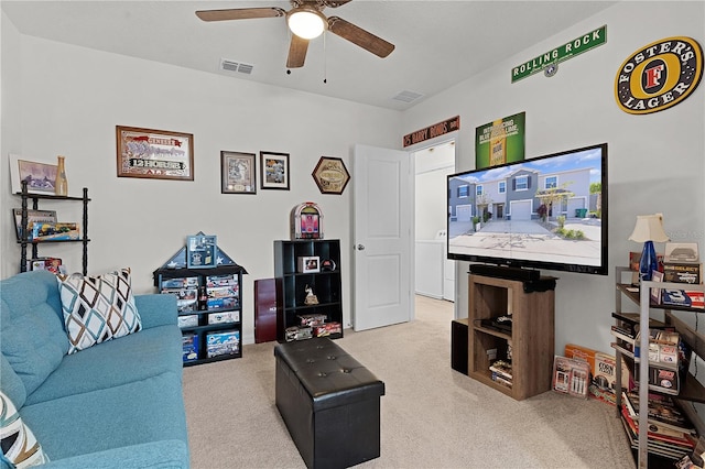 living room with light colored carpet and ceiling fan